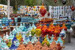 © gorelovs - Handmade colorful ceramic street lamps collected together