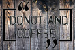 © Zofia - Handwriting text Donut And Coffee. Concept meaning common food and drink pairing in United States and Canada Wooden background vintage wood wild message ideas intentions thoughts