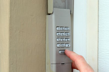Finger Pushing Buttons To Enter Secret Code On Keypad - Garage Door Opener - Home Security