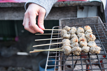 Wall Mural - Thai fish ball with bamboo stick on the stove. Selective focus