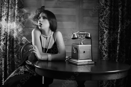 Beautiful 1930s girl smokes monochrome - Buy this stock ...