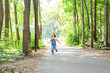 © satura_ - Children, childhood and nature concept - Portrait of beautiful small child girl running through the park