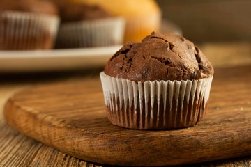 Chocolate cake and nut cake, homemade cakes on wooden background