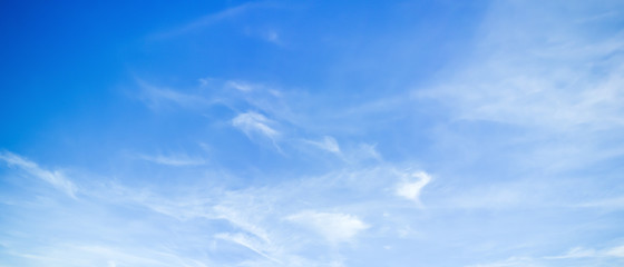 Wall Mural - Clouds on a blue sky as background