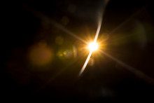 Abstract Natural Sun Flare On The Black Background.