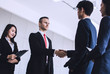 © khwanchai - shake hands and successful negotiation of business people