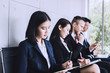 © khwanchai - group of people preparing interview and waiting in office