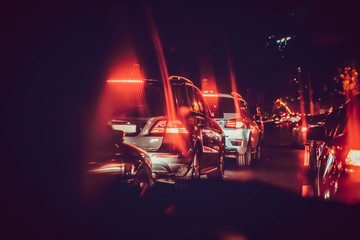 Cars in the night traffic jam . Looking behind the cars.Cars are red, yellow night light. Traffic jams in the city with row of cars on the road at night and bokeh lights in Baku with selective focus