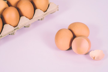 Fresh and Raw chicken eggs in egg on white background.