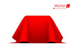 Object covered with red silk cloth. Empty podium or presentation. Secret box, cube hidden under satin fabric with drapery.