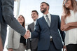 © ASDF - business partners greeting each other with a handshake