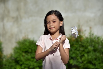 Adorable Beautiful Filipina Girl With Flower