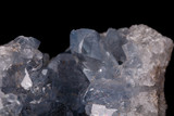 Fototapeta Tęcza - Celestine mineral stone macro on microcline on black background