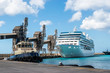 Bridgetown harbor, Barbados. Tugboat and cruise ship in port.