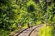 The natives family walking on railway tracks in Sri Lanka.