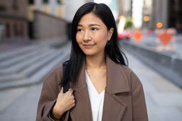 Canvas Print - Young Asian woman in city walking street