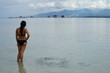 © Nicholas & Geraldine - Asian woman overlooking the water at Manjuyod Sandbar, Philippines