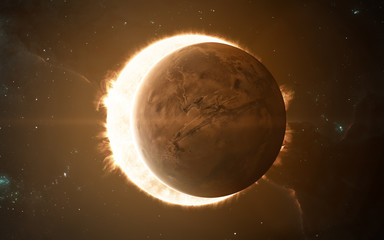 mars, eclipsing the sun. red planet of solar system. science fiction art. elements of the image were