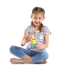 Sticker - Cute child playing with colorful blocks on white background