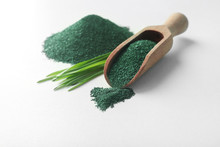 Composition With Spirulina Algae Powder And Grass Isolated On White
