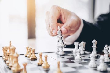 Wall Mural - Businessman playing chess game Planning of leading strategy successful business leader concept