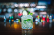 © Hakan Tanak - Green Gin Alcoholic Cocktail Drink on the Bar Desk