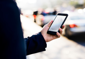 Woman using a smartphone with a screen mockup