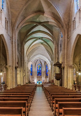 Wall Mural - View of the nave and gothic rib vault ceiling at the Paroisse Saint Pierre de Montmartre or the Church of Saint Peter of Montmartre, one of the oldest surviving churches in Paris