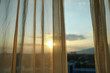 sun light through white curtain interior of window in the morning