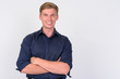 © Ranta Images - Happy young handsome blonde businessman with arms crossed