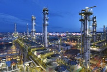 Industrial Plant Refinery At Night - Production And Processing Of Crude Oil 