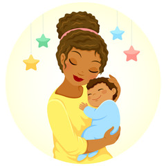 young mother of black ethnicity hugging a smiling baby boy