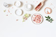 © tabitazn - Styled beauty frame, web banner. Skin cream, tonicum bottle, dry flowers, leaves, rose and Himalayan salt. White table background. Organic cosmetics, spa concept. Empty space, flat lay, top view.