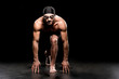 © LIGHTFIELD STUDIOS - handsome swimmer standing in start position on black background
