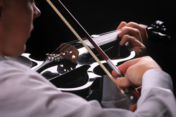 Wall Mural - Young men playing the violin