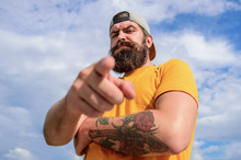 Hey You. Man Bearded Muscular Brutal Hipster Outdoors Sky Background. Masculinity And Brutality. Lumbersexual Tattooed Well Groomed Hipster. Hipster With Mustache And Long Beard. Talking To You