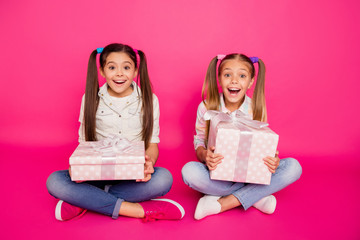 Sticker - Close up photo two wow faces little age she her girls holding hands arms large gift boxes best friends sit floor wear casual jeans denim checkered plaid shirts isolated rose vibrant vivid background