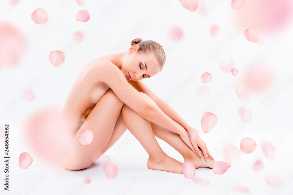 Side view photo pretty nude healthy beautiful she her woman ideal perfect clean flawless skin closed eyes sitting floor hugging legs pampering isolated pink white background - obrazy, fototapety, plakaty 