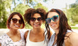 © Syda Productions - female friendship, people and leisure - happy young women in sunglasses at summer park