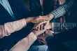 © deagreez - Cropped close-up view of nice stylish sharks experts executive managers staff putting palms on each other gathering result achievement corporate cooperate at work place station