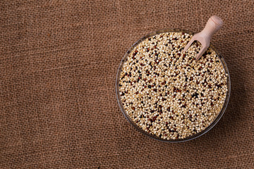 Wall Mural - Quinoa seeds in glass bowl from above.