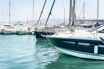 Sailboat harbor with many beautiful sail yachts in the sea port, water transport