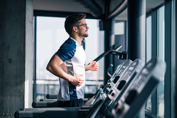 Man running on treadmill.