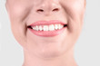 © New Africa - Young woman with healthy teeth smiling on white background, closeup