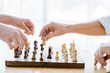 © LIGHTFIELD STUDIOS - cropped view of retired men playing chess at home