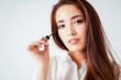 © Galina Zhigalova - Mascara make up beauty asian young woman with dark long hair on white background