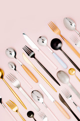 .Collection of various cutlery on pastel background, flat lay, top view,.