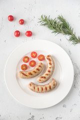 Canvas Print - Grilled sausages with cherry tomatoes