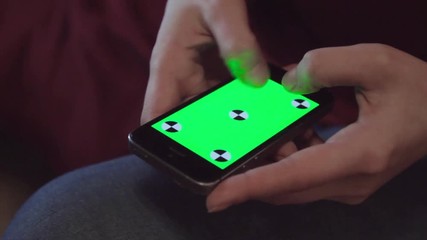 Female Teen Hands Using Smartphone With Green Screen Sitting