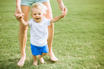 Cute little boy learing to walk.